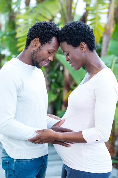 Man touching pregnant wife belly — Stock Photo, Image