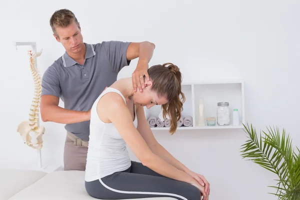 Doctor doing neck adjustment — Stock Photo, Image