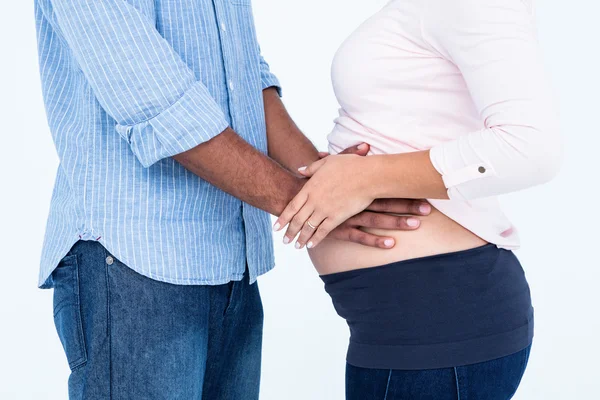 Husband touching pregnant wife belly — Stock Photo, Image