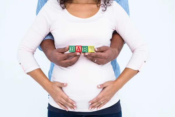 Man met vrouw houden baby tekst — Stockfoto