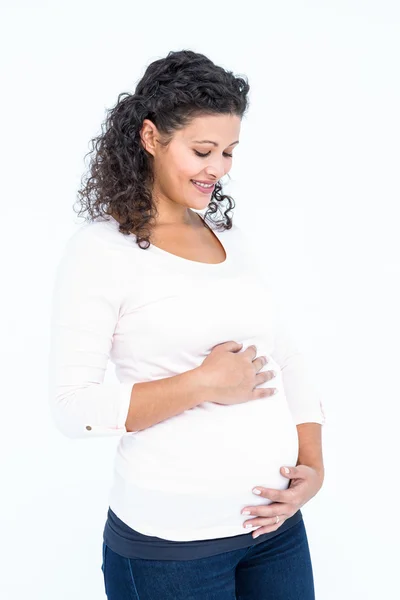 Mujer embarazada tocando el abdomen —  Fotos de Stock