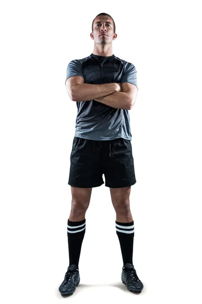 Säker rugbyspelare med armarna korsade — Stockfoto
