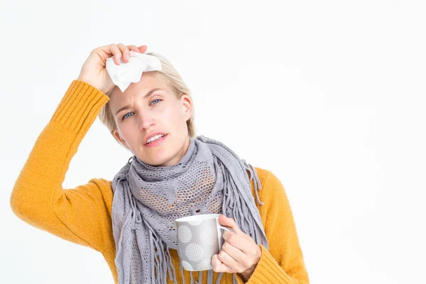 Woman feeling her forehead — Stock Photo, Image