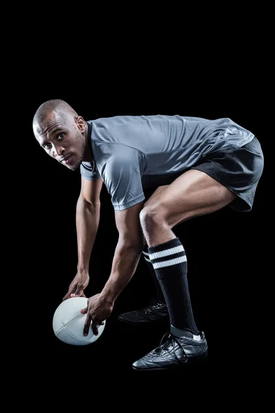 Rugby player holding ball — Stock Photo, Image