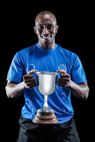 Feliz atleta segurando troféu — Fotografia de Stock