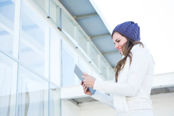 Happy brunette using tablet pc — Stock Photo, Image