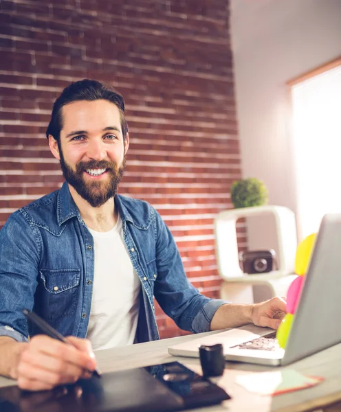 Smiling businessman using graphic tablet — Stock Photo, Image