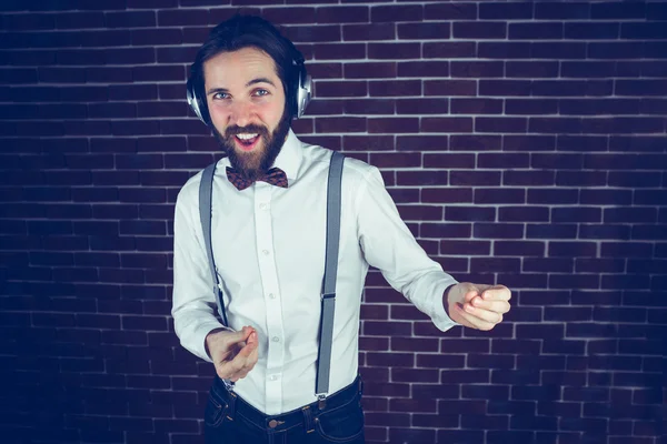 Happy hipster enjoying listening music — Stock Photo, Image