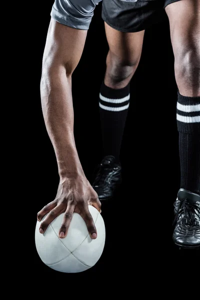 Athlete holding rugby ball — Stock Photo, Image