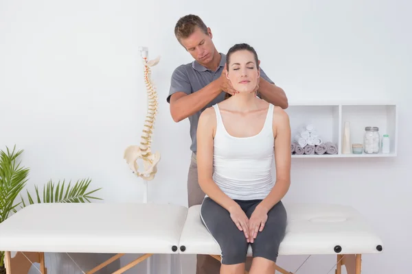 Doctor doing neck adjustment — Stock Photo, Image