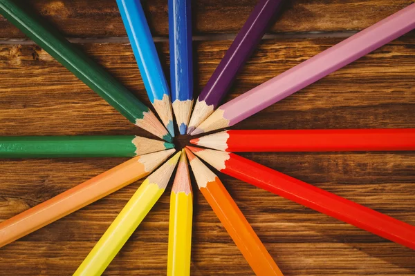 Colour pencils on desk in circle shape — Stock Photo, Image