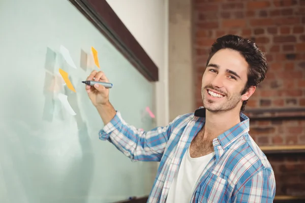 Businessman holding marker — Stock Photo, Image