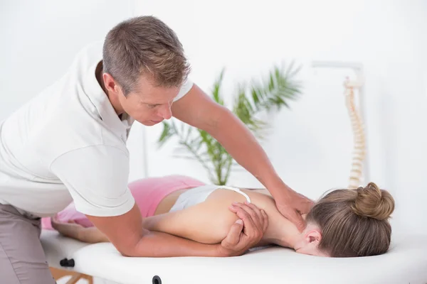 Physiotherapist doing neck massage to patient — Stock Photo, Image