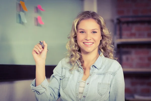 Businesswoman holding marker — Stock Photo, Image