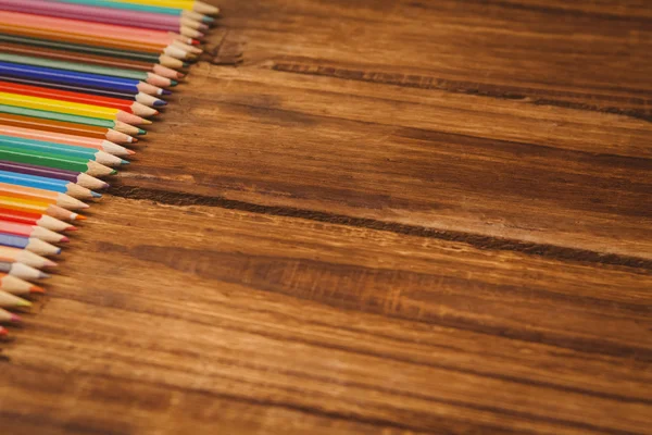 Colour pencils on desk — Stock Photo, Image