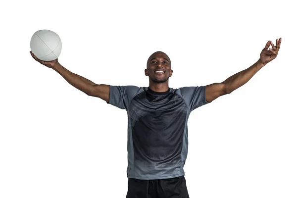 Atleta sosteniendo pelota de rugby — Foto de Stock