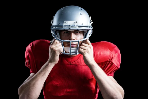 Jogador de futebol americano segurando capacete — Fotografia de Stock