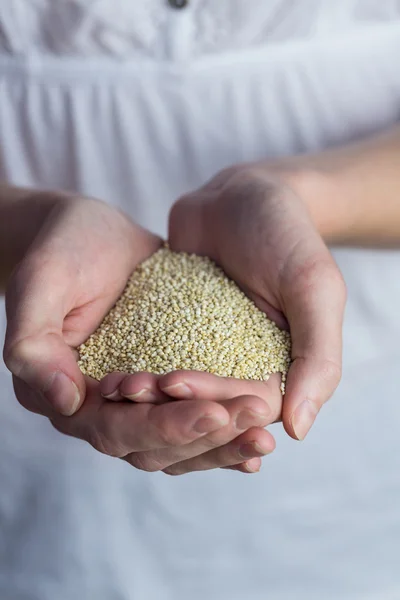 Woman showing handful of sesame seed — Stock Photo, Image