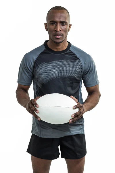 Desportista confiante segurando bola de rugby — Fotografia de Stock