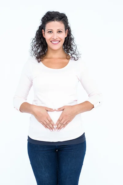 Беременная женщина трогает абодомен — стоковое фото