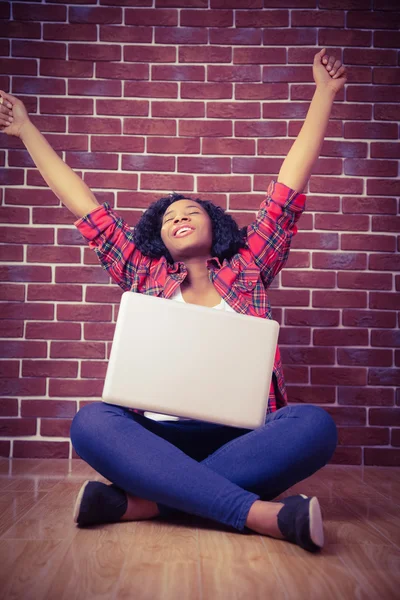 Hipster cheering and using laptop — Stock Photo, Image