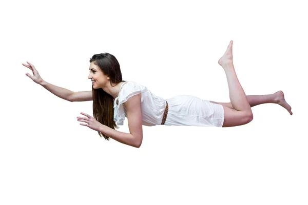 Girl in white dress floating in air — Stock Photo, Image