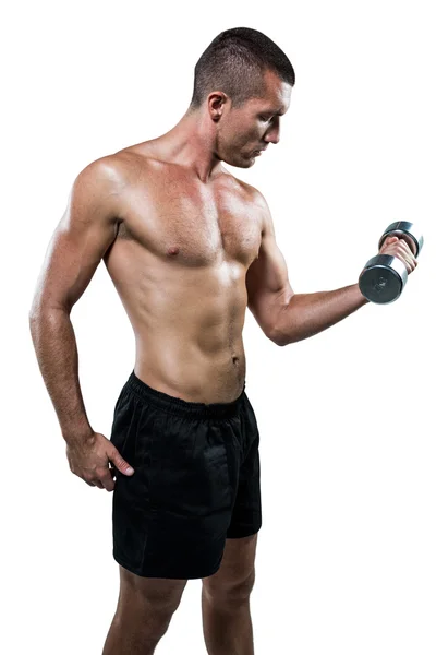 Athlete working out with dumbbell — Stock Photo, Image