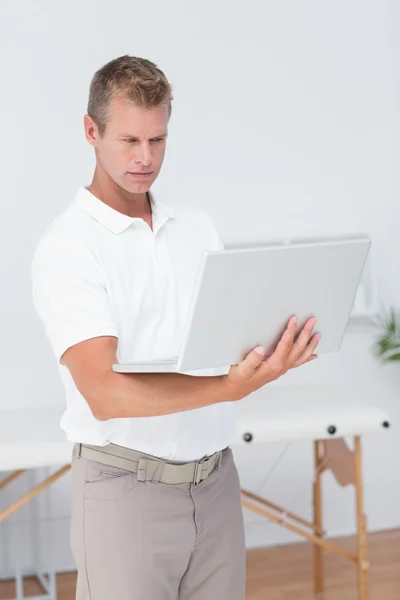 Concentrated doctor using computer — Stock Photo, Image