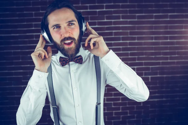 Handsome hipster listening music — Stock Photo, Image