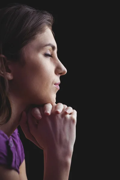 Woman praying with hands together — Stock Photo, Image