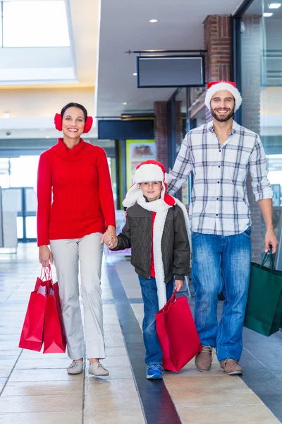 Happy family in shopping mall — Stock Photo, Image