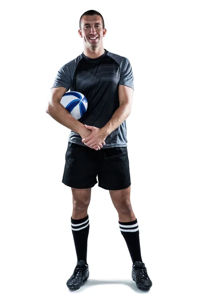 Lächelnder Rugbyspieler mit Ball — Stockfoto