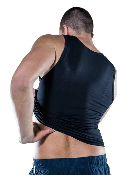 Athlete with back pain over white — Stock Photo, Image