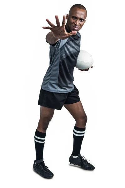 Sportman gebaren met rugbybal — Stockfoto