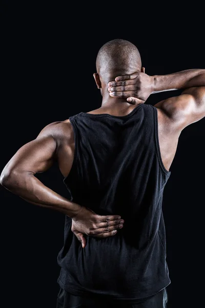 Homem muscular que sofre de dor nas costas — Fotografia de Stock