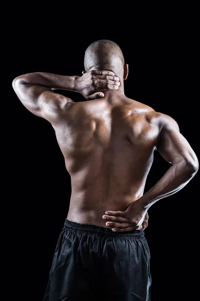 Muskulös atlet stretching — Stockfoto