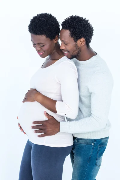 Man hugging pregnant wife while standing — Stock Photo, Image