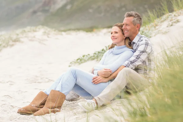 Smiling couple sitting together Royalty Free Stock Photos