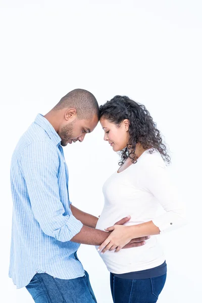 Man looking at pregnant wife belly — Stock Photo, Image