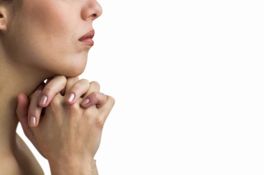 Close-up of woman praying with joining hands  clipart