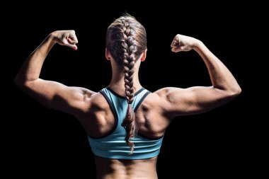 Rear view of woman with braided hair flexing muscles clipart