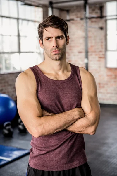 Portrait of a serious man with arms crossed — Stock Photo, Image