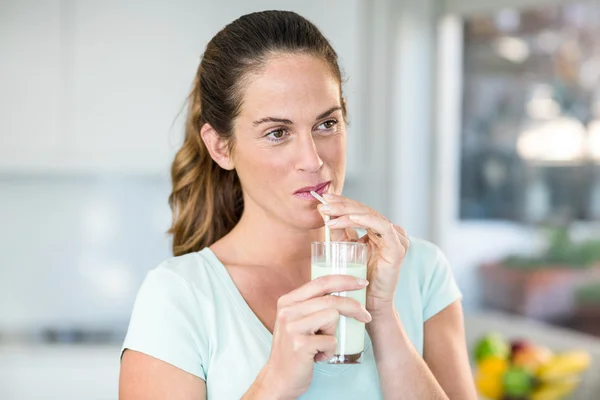 Happy woman drinking juice — Stock Photo, Image