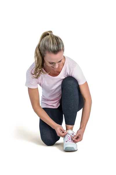 Sporty woman tying shoelace — Stock Photo, Image