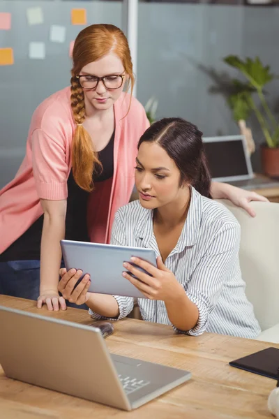 Businesswomen using digital tablet — Stock Photo, Image