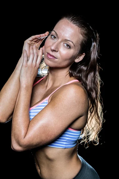 Seductive bodybuilder against black background — Stock Photo, Image