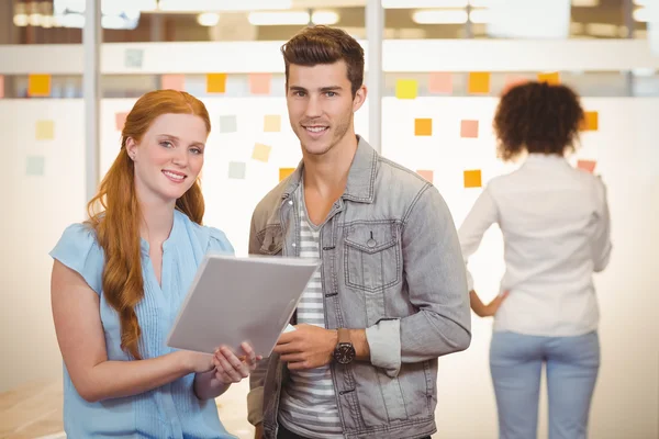 Portrait of business people looking at document — Stock Photo, Image