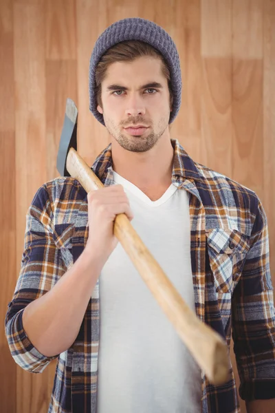 Portrait of hipster holding axe on shoulder — Stock Photo, Image