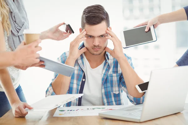 Businessman with head in hands — Stock Photo, Image