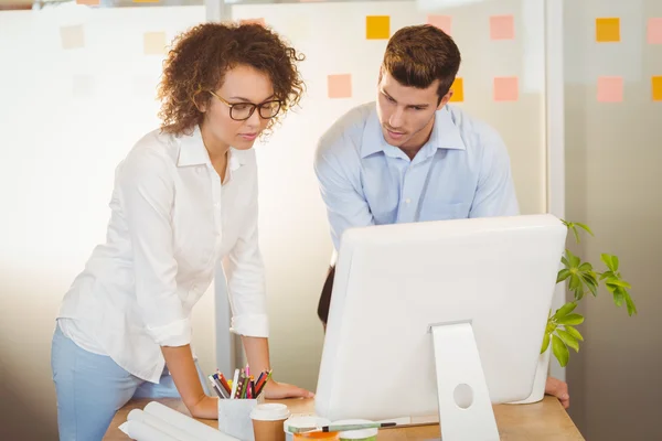 Business people standing by table — Stock Photo, Image